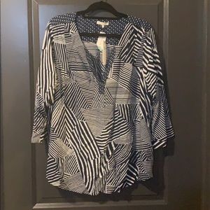 Blue and white blouse, skies are blue